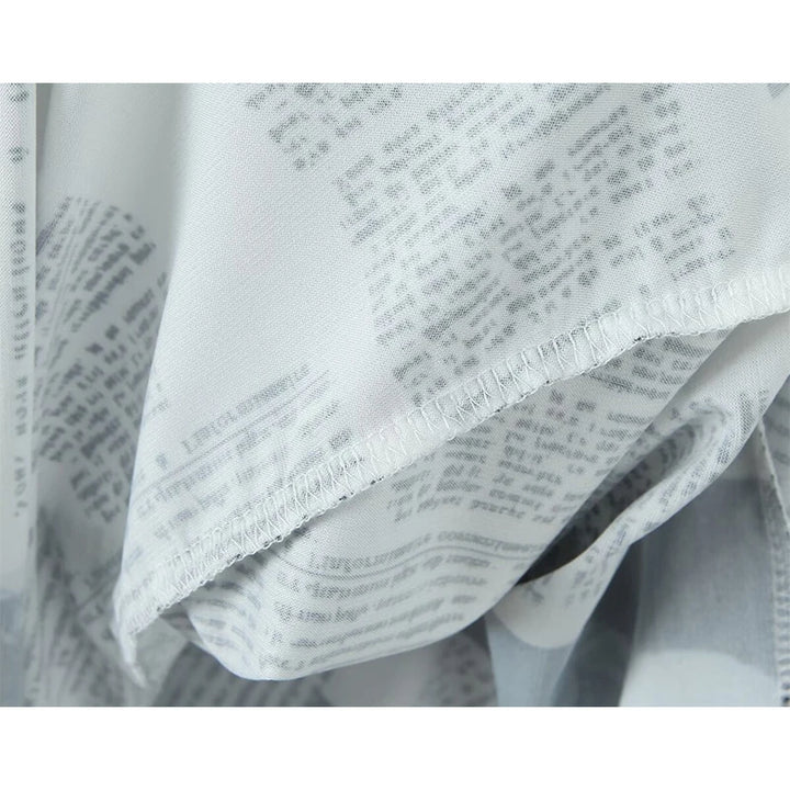 YENKYE New Women Newspaper Letter Print Irregular Hem Sling Dresses Fashion Backless Thin Straps With Chain Summer Sexy Dress